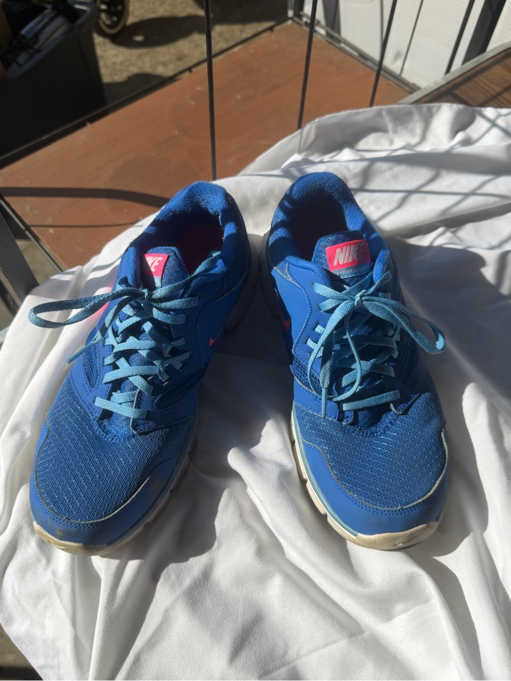 Nike Blue Sneakers with Pink Logo Highlights